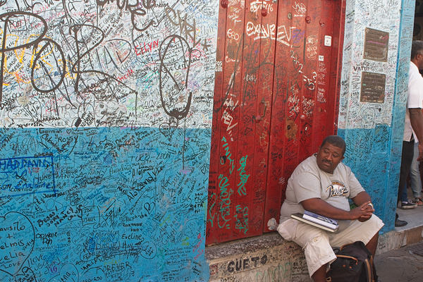 Graffiti-Covered Wall with Seated Man Print