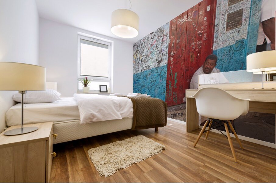 Graffiti-Covered Wall with Seated Man Mural print