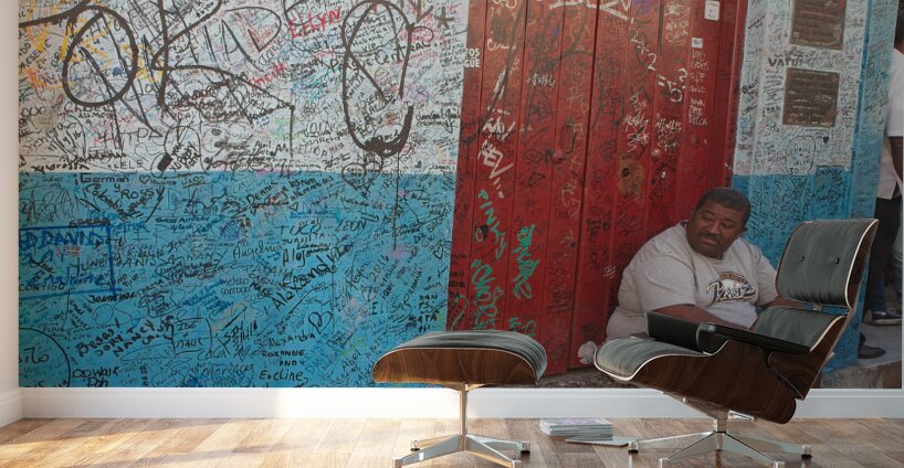 Graffiti-Covered Wall with Seated Man Wall Murals